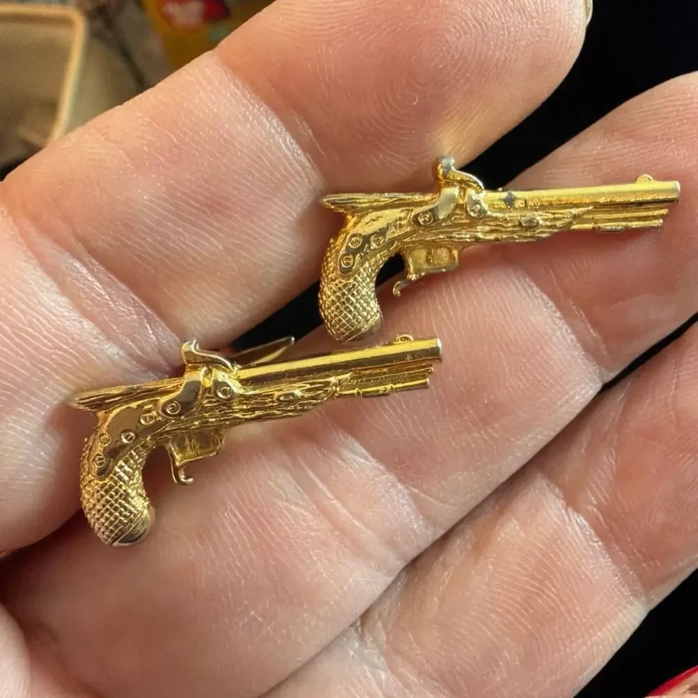 Gold tone revolver gun tie clip and cuff links